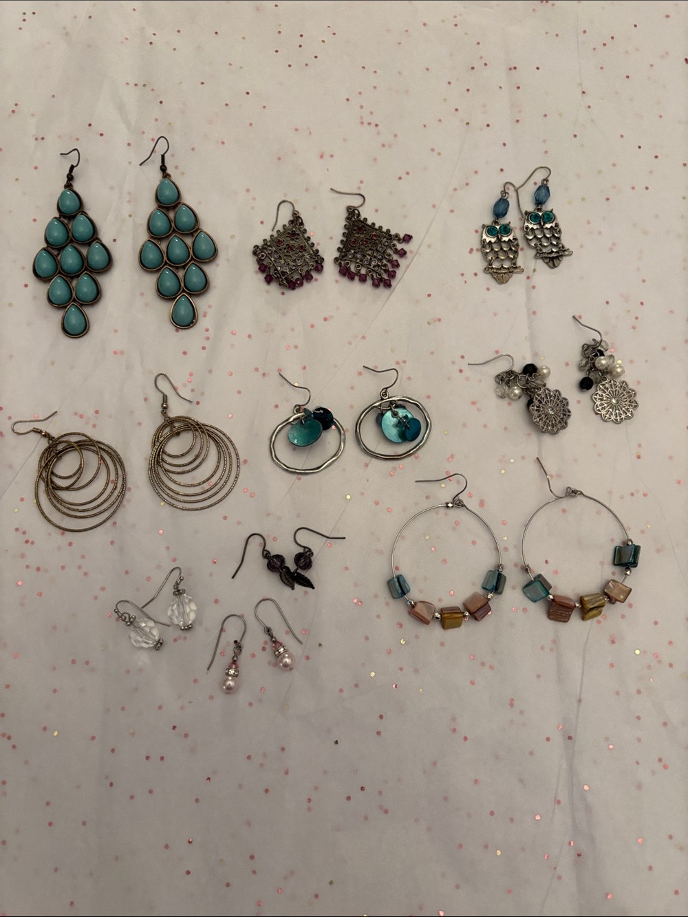10 pair of assorted‎ earrings.